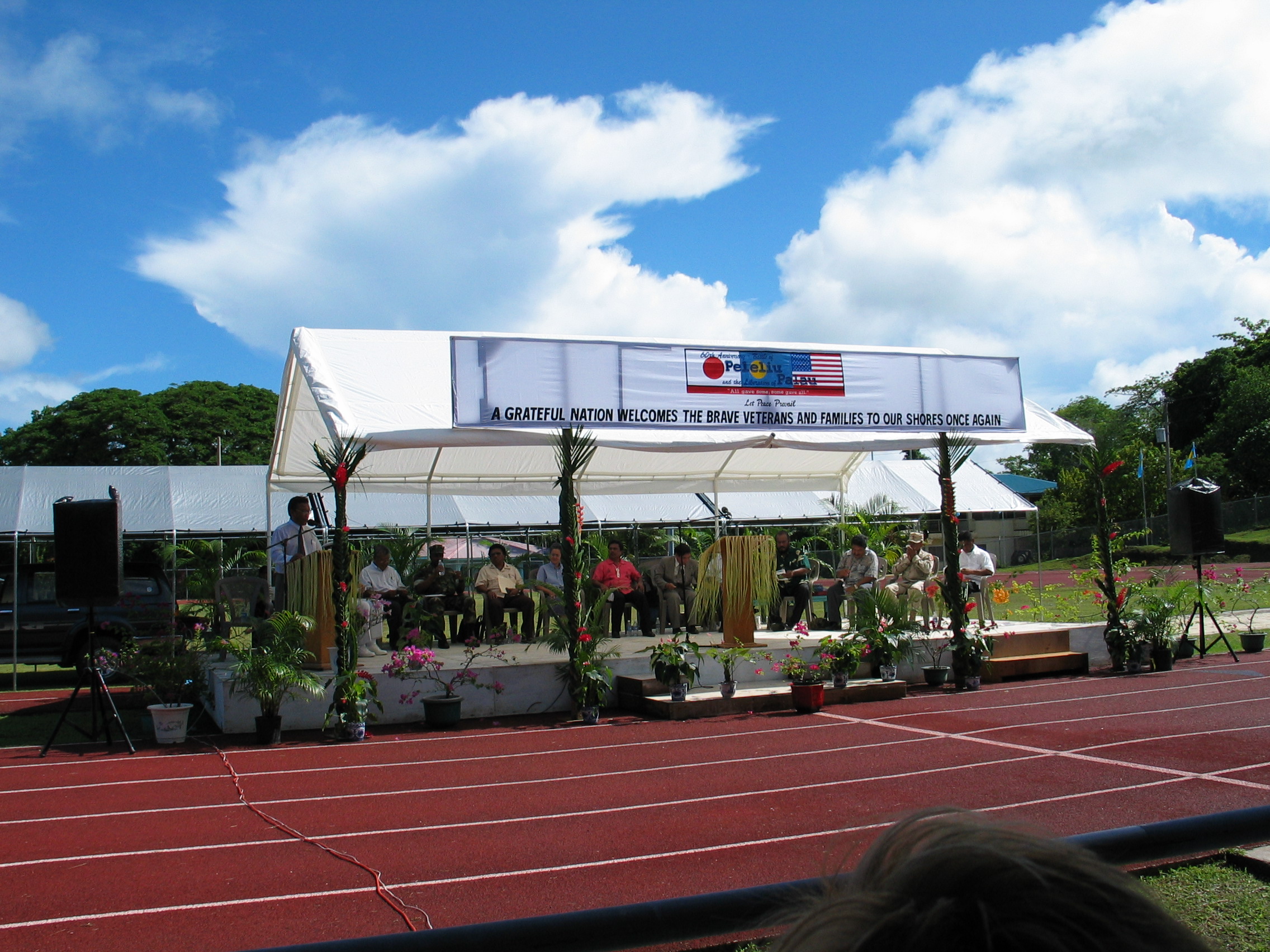 track and field with tent and spectators